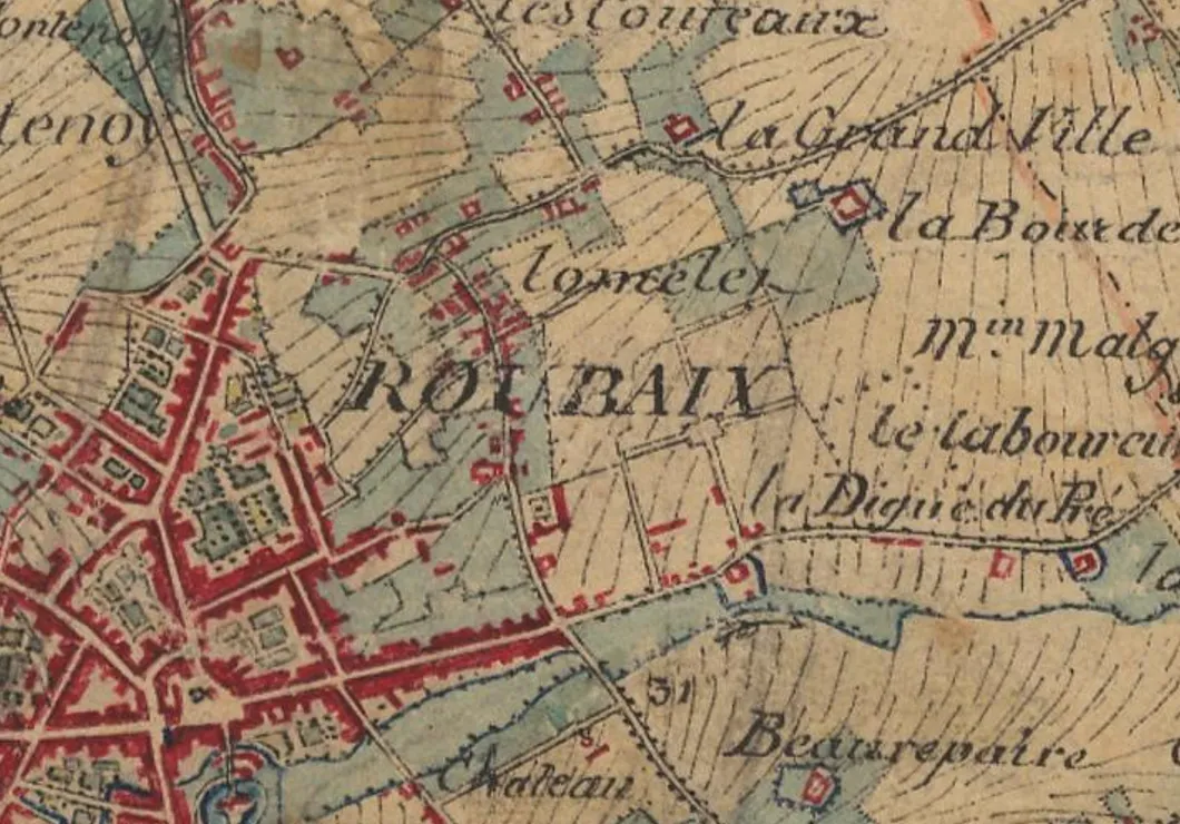 Carte ancienne en couleurs : le centre de Roubaix en rouge, et au nord-est le lieu-dit Lomelet au milieu des champs, traversé par un chemin